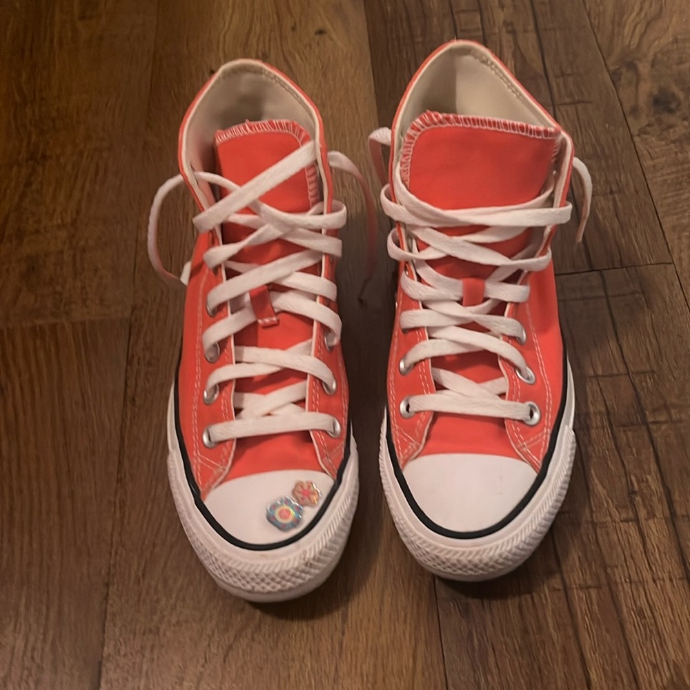 pink hightop converse with stickers